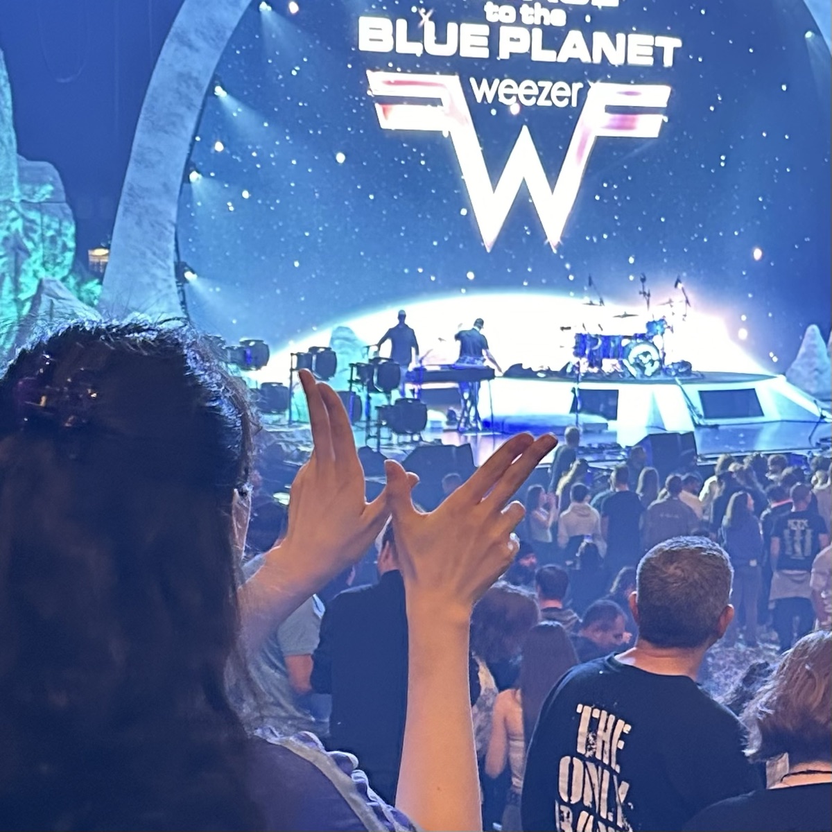 Making a W with my hands at a Weezer concert
